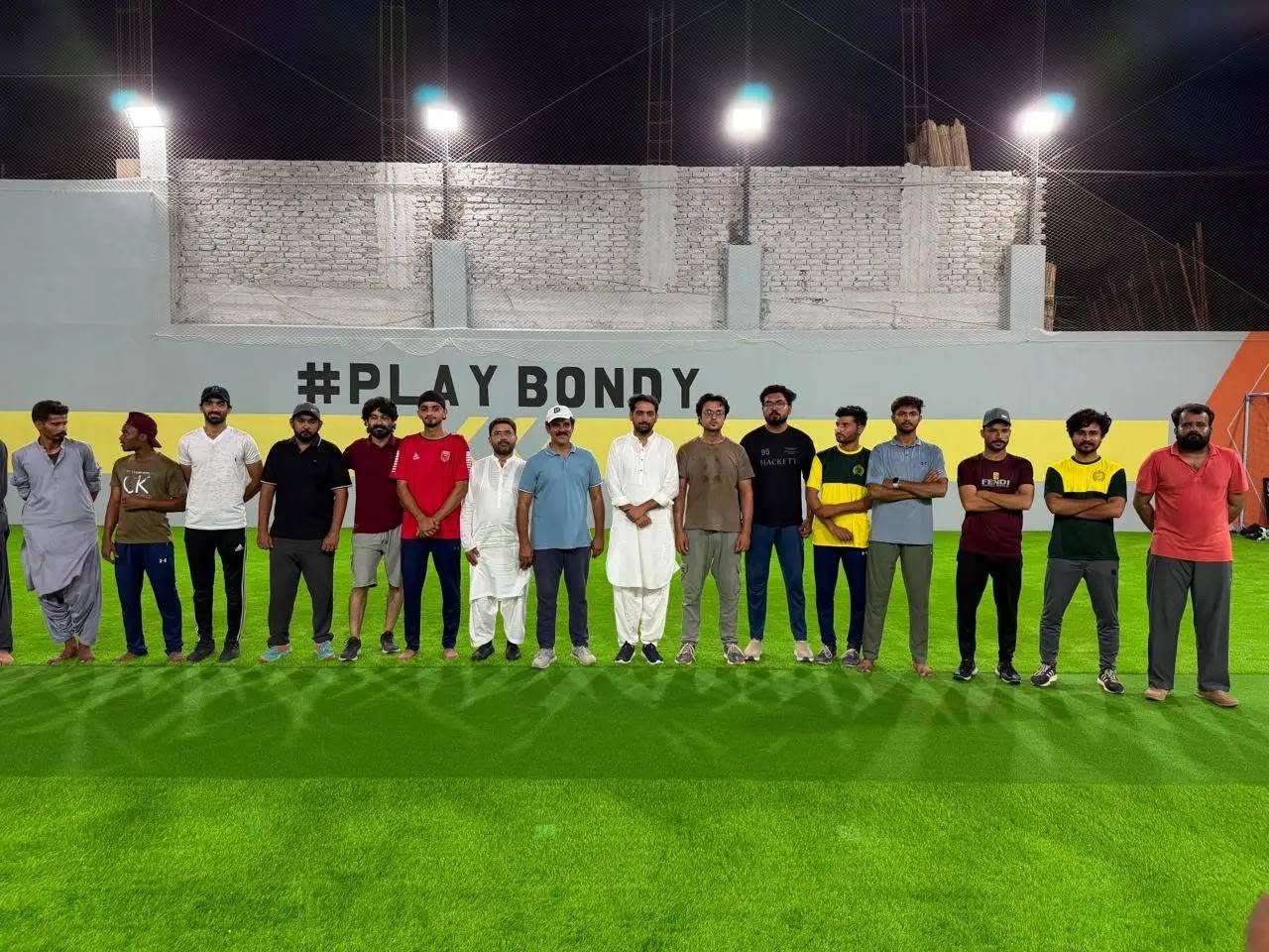 Players at GR Sports Arena under floodlights